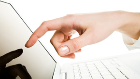employee at desk using online employee benefits manager