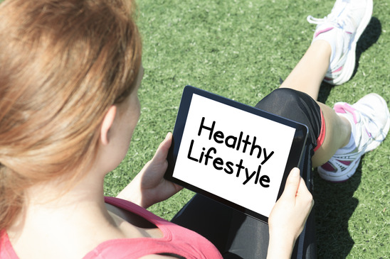 healthy woman looking on online health stuff on tablet