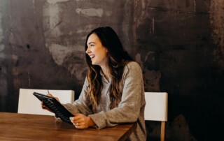 A Woman Making Notes During an Interview