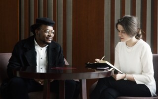 A manager conducts a meeting.