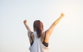 A Woman Raising Both Her Hands