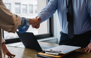 Job Candidate and HR Employee Shaking Hands