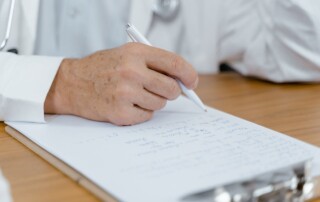 Person reviewing paperwork for ACA reporting compliance