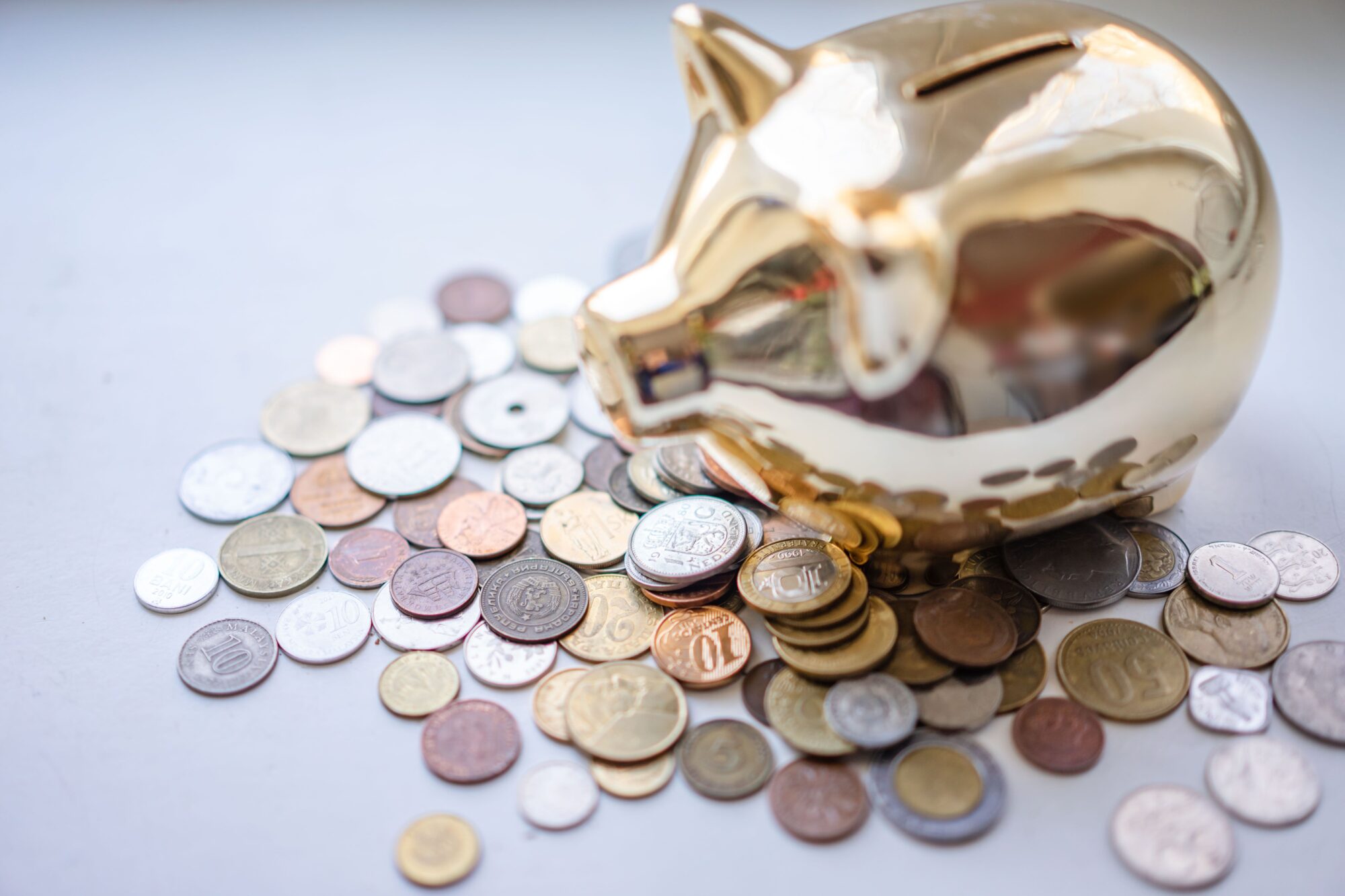 Gold piggy bank representing HSA savings and the triple tax advantage of tax-free contributions, growth, and healthcare withdrawals.