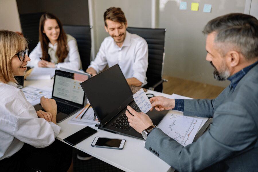 Employee benefits consultant presenting employee benefits strategies to a Doylestown, PA business team during a planning meeting