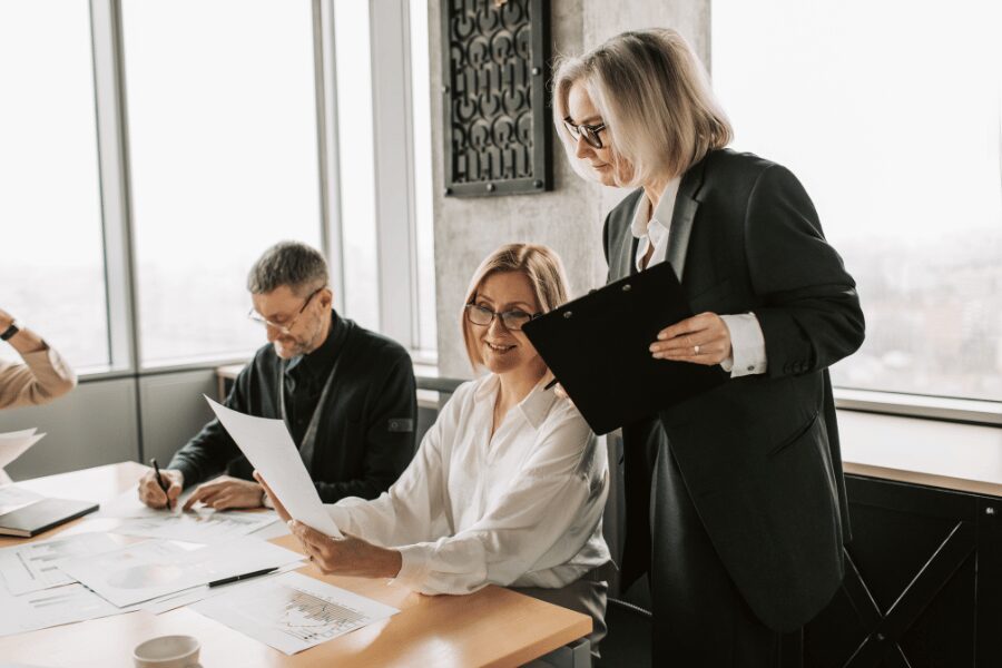 Employee benefits consultant reviewing employee benefits plans with a Newtown, PA business leadership team