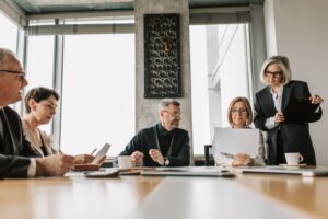 Executives discussing employee health plan funding and benefits strategy
